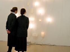 Two students looking at a display of lights